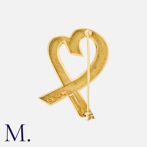 21 - TIFFANY & CO. An Open Heart Brooch in 18K yellow gold, with stylised open heart design. Signed Palom... 