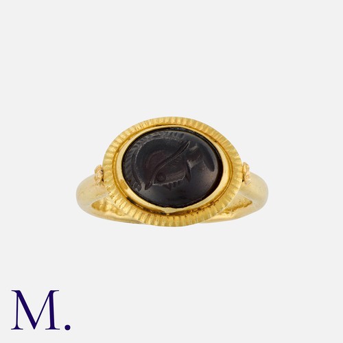 94 - An Antique Intaglio Signet Ring set with an oval-shaped garnet intaglio depicting a head (possibly o... 