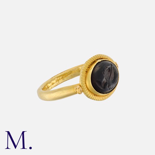 94 - An Antique Intaglio Signet Ring set with an oval-shaped garnet intaglio depicting a head (possibly o... 