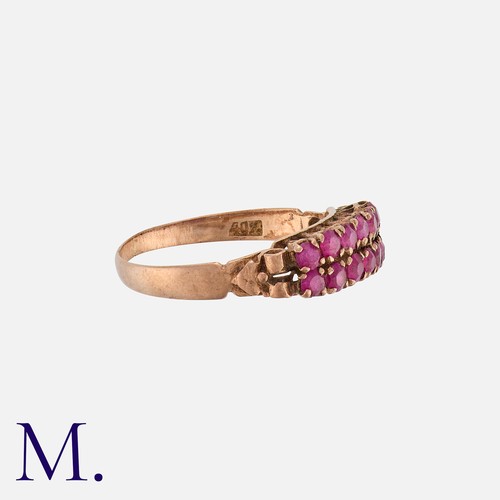 1 - An Antique Double Row Ruby Ring in rose gold, with pierced gallery set with two rows of seven round ... 