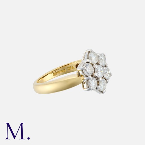 183 - A Diamond Cluster Ring in 18k yellow gold, set with seven round cut diamonds totalling approximately... 