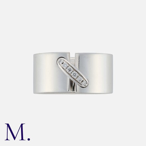 147 - CHAUMET. A Jeux De Liens Diamond Ring in 18k white gold, the wide band featuring a 'bridge' set with... 