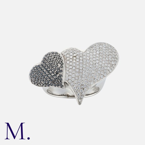 166 - A Diamond Love Heart Ring in 18k white gold, comprising two pave set diamond hearts, white diamonds ... 