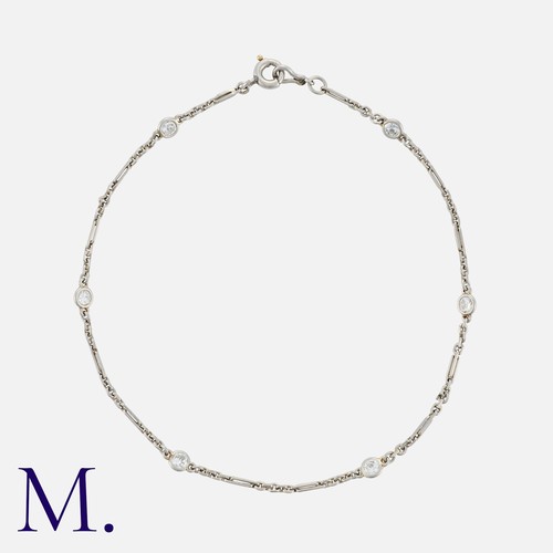 139 - An Art Deco Diamond Bracelet in platinum, comprising a series of interlocking links punctuated by be... 