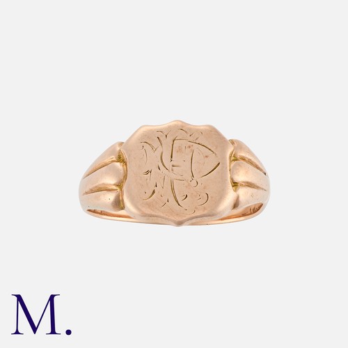 205 - An Antique Signet Ring in 9K Gold, with fluted shoulders with engraved shield.  Hallmark for 9ct gol... 