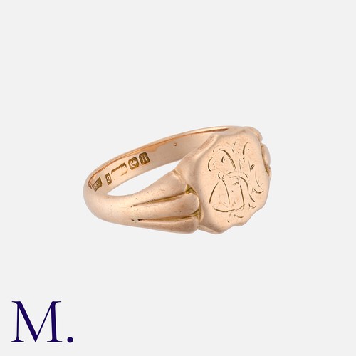 205 - An Antique Signet Ring in 9K Gold, with fluted shoulders with engraved shield.  Hallmark for 9ct gol... 