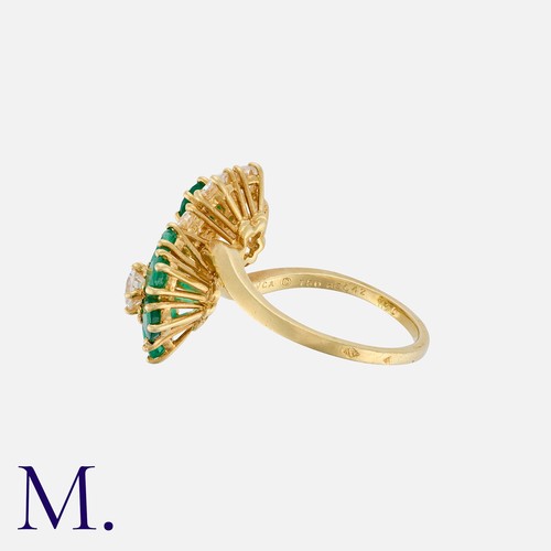 47 - VAN CLEEF & ARPELS. An Emerald and Diamond Ring in 18K yellow gold, set with round cut emeralds and ... 