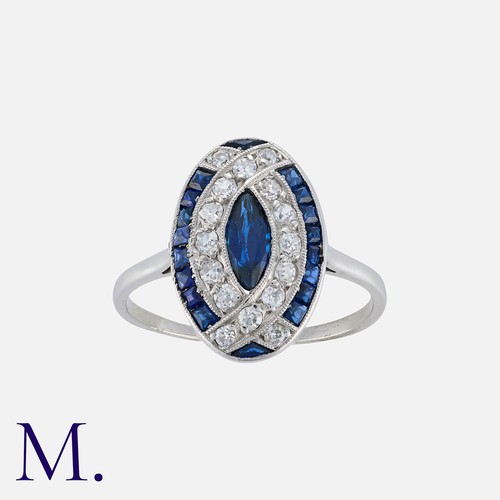 134 - An Art Deco Sapphire and Diamond Ring in platinum, set with a marquise sapphire to the centre with c... 