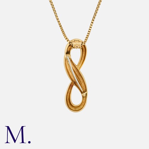 64 - VAN CLEEF & ARPELS. An Infinity Pendant Brooch and Chain in 18K yellow gold, with looping pendant wi... 