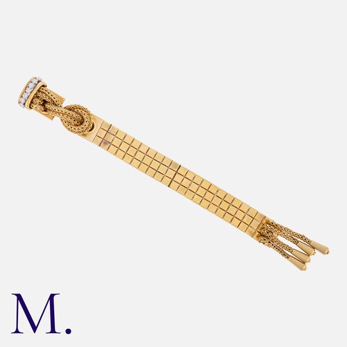 176 - MARCHAK. A Diamond-Set Bracelet in 18K yellow gold, with woven strands and tassels to a geometric br... 