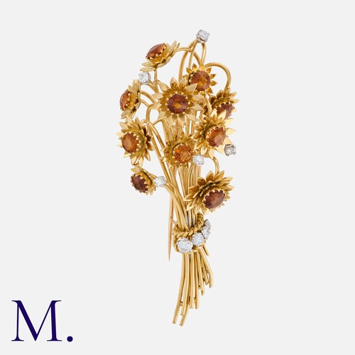 85 - MARCHAK. A Citrine and Diamond Brooch in 18K yellow gold in the form of a bouquet of flowers, each f... 