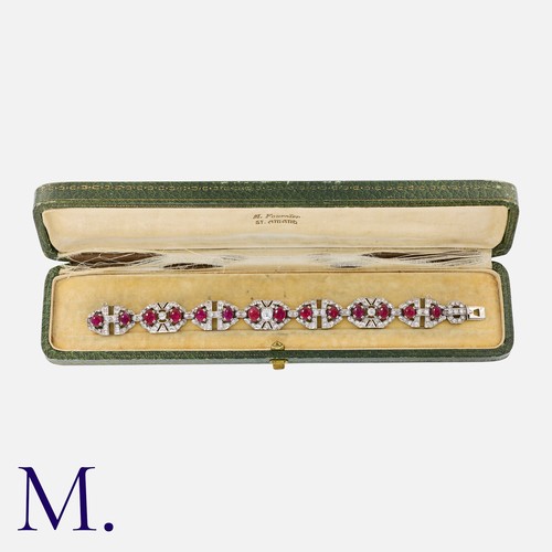 31 - A Burma Ruby and Diamond Bracelet in platinum, set with 14 cabochon rubies (accompanied with a labor... 