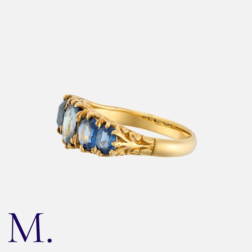 198 - A Sapphire Five Stone Ring in yellow gold, set with a graduated row of oval cut blue sapphires. Unma... 