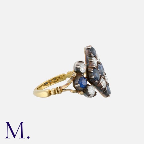 65 - An Antique Sapphire And Diamond Ring in yellow gold, of kite shape, set with round cut sapphires and... 