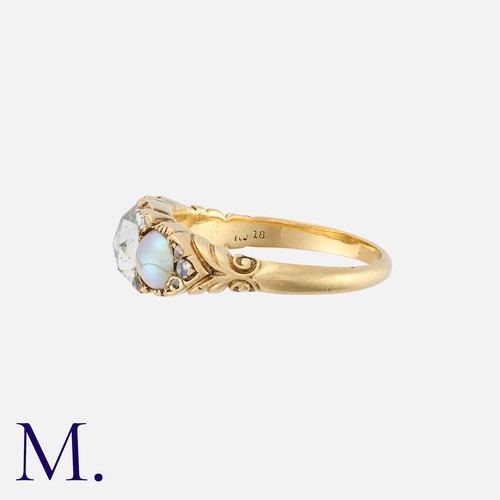 82 - A Rose Cut Diamond And Pearl Three Stone Ring in 18k yellow gold, set with a principal rose cut diam... 