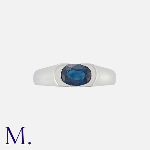 66 - A Sapphire Ring in 18k white gold, set with an oval cut blue sapphire. Marked 750 for 18 carat gold.... 