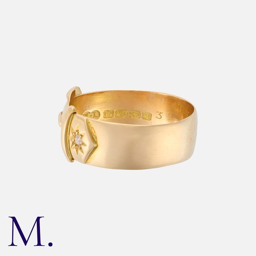 32 - A Diamond Belt Buckle Ring in 18k yellow gold, of buckle design, set with two round cut diamonds. Ha... 