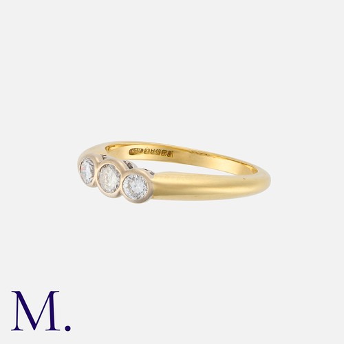 188 - A Diamond Three Stone Ring in 18k yellow gold, bezel set with three round cut diamonds totalling app... 