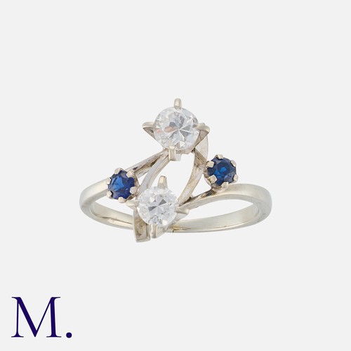 84 - A French Sapphire And Diamond Ring in 18k white gold, set with two round cut diamonds totalling appr... 