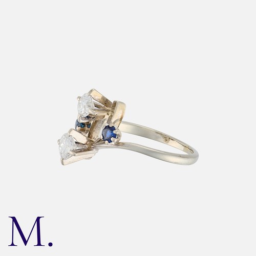 84 - A French Sapphire And Diamond Ring in 18k white gold, set with two round cut diamonds totalling appr... 