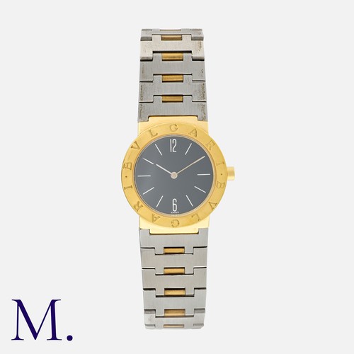 149 - BULGARI, A Ladies Wristwatch in stainless steel and gold, the  black dial and Arabic numeral and bat... 