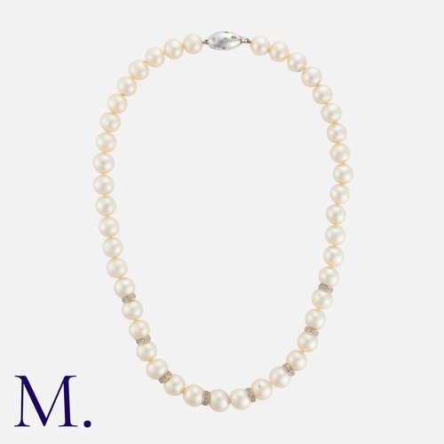 67 - A Pearl And Diamond Necklace in 18k white gold, comprising a single strand of pearls measuring appro... 