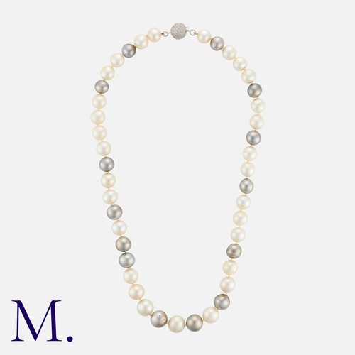 167 - A Pearl And Diamond Necklace in 18k white gold, comprising a single strand of pearls measuring appro... 