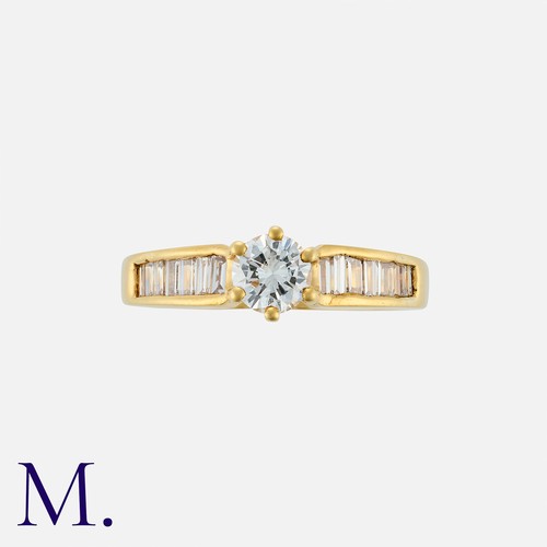 161 - A Diamond Solitaire Ring in 18k yellow gold, set with a central round cut diamond of approximately 0... 