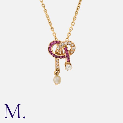 122 - An Edwardian Ruby, Diamond and Pearl Pendant Necklace in yellow gold, with knot design set with cali... 