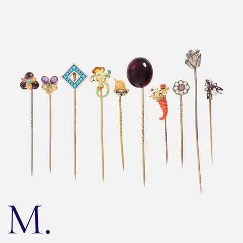 168 - A Fine Collection of Stick Pins in yellow metal including an Egyptian revival pin, various gem-set p... 