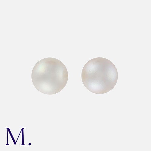 169 - A Pair of Pearl Stud Earrings in yellow gold, each set with a half pearl, with sprung defender-style... 