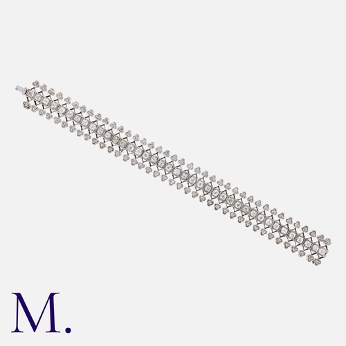 130 - A Diamond Bracelet in 18K white gold set with old cut diamonds along the centre weighing approx. 5.8... 