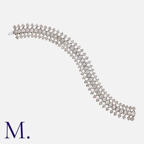 130 - A Diamond Bracelet in 18K white gold set with old cut diamonds along the centre weighing approx. 5.8... 