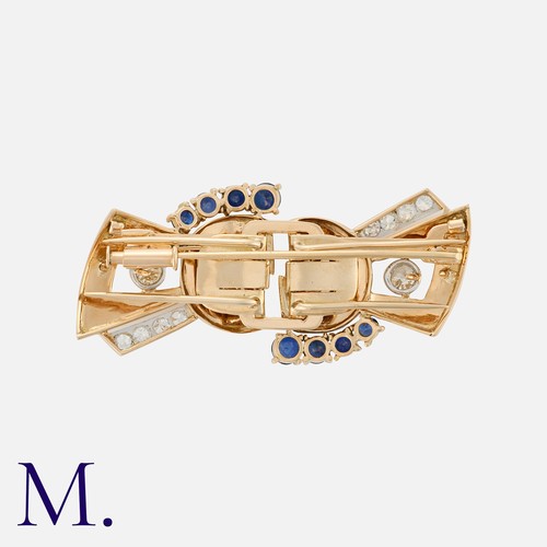 108 - A Retro Sapphire And Diamond Double Clip Brooch in yellow gold, comprising two clips, fastening to a... 