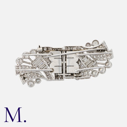 202 - An Art Deco Diamond Double Clip set with round cut and baguette cut diamonds weighing approx. 3.0ct ... 