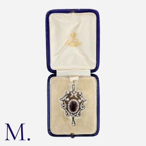 38 - An Antique Garnet and Diamond Pendant in yellow gold and silver, set with a large cabochon garnet wi... 