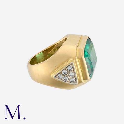 104 - A Green Paste And Diamond Ring in 18k yellow gold, set with a large octagonal cut green paste, accen... 