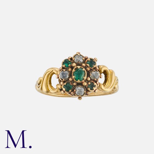 56 - An Antique Emerald And Diamond Cluster Ring in yellow gold, a cluster of emeralds and rose cut diamo... 