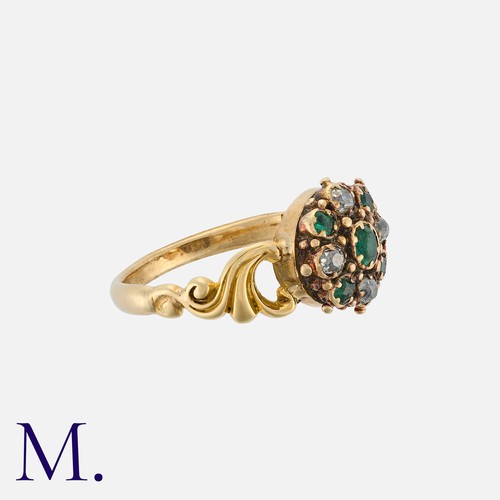 56 - An Antique Emerald And Diamond Cluster Ring in yellow gold, a cluster of emeralds and rose cut diamo... 