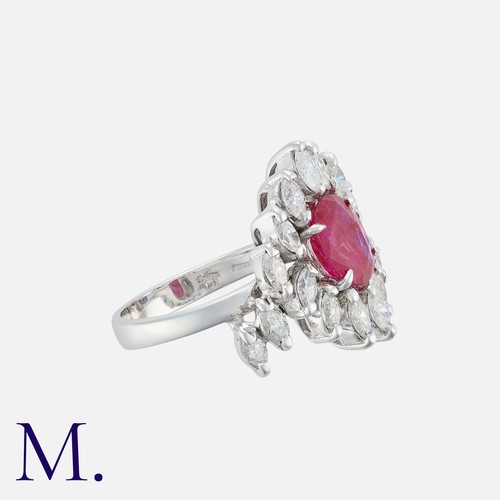 40 - A Burma No Heat Ruby And Diamond Cluster Ring in 18 carat gold. Set with a principal cushion cut rub... 