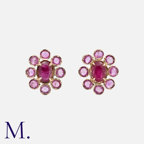 77 - A Pair Of Ruby Cluster Earrings in yellow gold, comprising a cluster of oval and cabochon rubies. Un... 