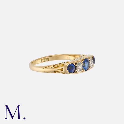 116 - A Sapphire And Diamond Five Stone Ring in 18k yellow gold, set with an alternating row comprising th... 