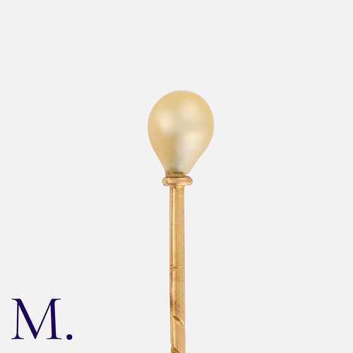262 - A Pearl Pin in yellow gold, with a pearl top (untested).  Unmarked; tests indicate pin is 14ct gold.... 