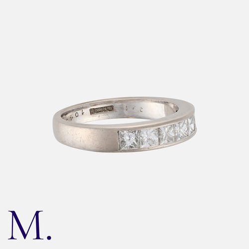 152 - A Diamond Band in 18K white gold, channel set with seven princess cut diamonds weighing approx. 1.25... 