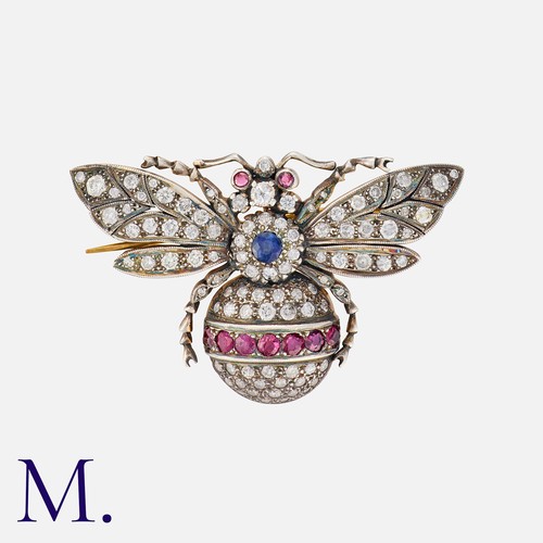 241 - A Ruby, Sapphire and Diamond Bee Brooch in yellow gold and silver, set with round cut rubies, diamon... 