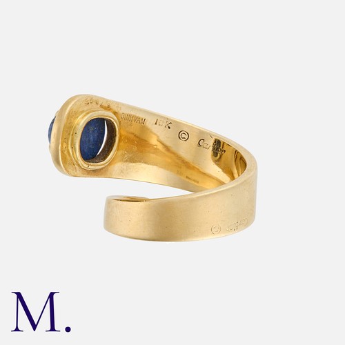 127 - DINH VAN for CARTIER, A Lapis Lazuli Ring in 18k yellow gold, of coiled design, set with an oval cab... 
