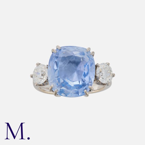 65 - A 10.54 Carat Sapphire And Diamond Three Stone Ring in 18k white gold. Set with a principal cushion ... 