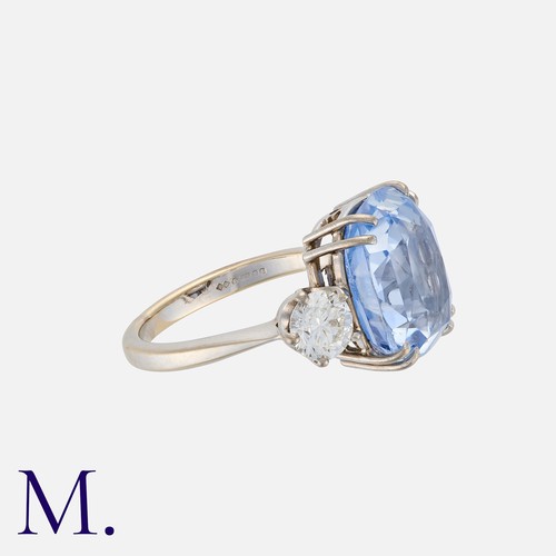 65 - A 10.54 Carat Sapphire And Diamond Three Stone Ring in 18k white gold. Set with a principal cushion ... 