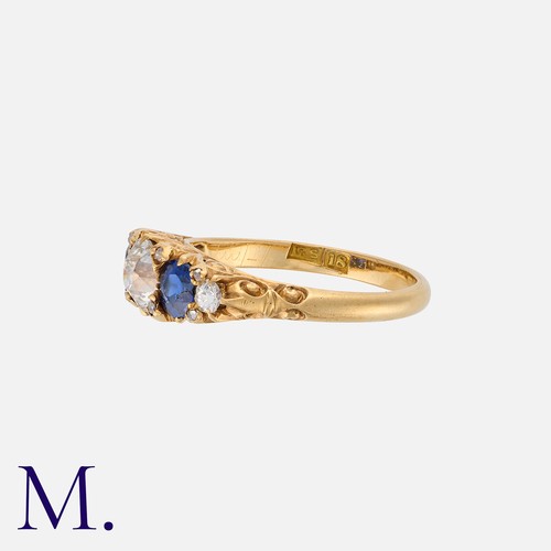 148 - An Antique Sapphire And Diamond Five Stone Ring in 18k yellow gold, set centrally with an old cut di... 