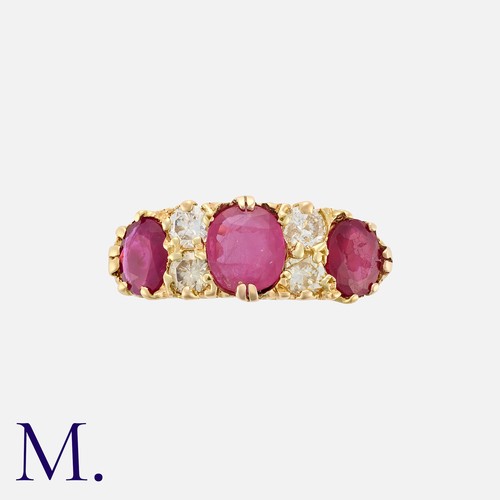 84 - A Vintage Ruby And Diamond Ring in 18k yellow gold, set with three oval cut rubies totalling approxi... 